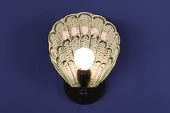 Illuminated Coquille shell wall sconce with a powder-coated steel shade hand-painted in layers of vista green and olive brushwork, sealed in clear coat and finished with polished brass hardware, designed as one-of-a-kind wall lighting for artistic homes and boutique spaces