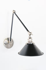 Black and Chrome adjustable wall sconce with a cone shade