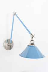 Pastel baby blue and chrome adjustable wall sconce with a cone shade.  Colorful bedside lighting fixture to provide task lighting or to be above open shelving