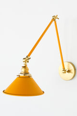 Mustard & Brass adjustable cone sconce for kitchen lighting above windows or above open shelving cabinetry. Also makes a great bedside reading light that frees nightstand space. Available in 3 finishes and 30 colors. Available in neutrals or fun, bright colors that work in any maximalist or kid-friendly space. Classic style wall sconce that has been updated by our curated color palette of brights, darks, and pastel hues. Designed and made by Sazerac Stitches.