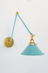 Pastel Teal and Brass adjustable cone sconce for kitchen lighting above windows or above open shelving cabinetry.  Also makes a great bedside reading light that frees up space on your nightstands. Comes in three finishes and over 30 colors for a custom look.  Available in neutrals or fun, bright colors that work in any maximalist or kid-friendly space.  Classic style wall sconce that has been updated by our curated color palette of brights, darks, and pastel hues.  Designed and made by Sazerac Stitches.