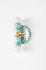 Teal and cream marbled statement sconce, Thalia two-light wall fixture with handmade swirled finish and modern shape, perfect for eclectic interiors, pastel bathrooms, and colorful home lighting lovers
