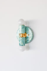 Teal and cream marbled Thalia sconce with ocean-inspired swirls, compact two-bulb wall fixture for bathroom vanity lighting, entryway walls, stairway lighting, or a pretty powder room with designer details