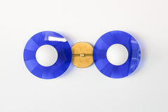 Statement lighting for modern interiors: The eye-catching Circus Sconce by Sazerac Stitches in bright blue and brass