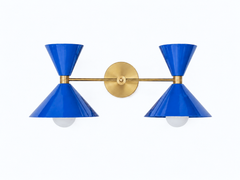 Bold bright blue and brass two light oversized bathroom wall sconce. Mid-century modern style wall sconce that is perfect for bold, colorful bathrooms, kids bathrooms, eclectic design, and more.  Fun way to introduce color to a bathroom or match wallpaper. Helps create a statement bathroom or powder room.