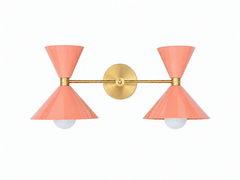 Creamy peach and brass mid-century mdoern style two light bathroom vanity wall sconce with oversized cone shades. Add a pop of color, match a colorful wallpaper, or make a kids bathroom high-end and colorful with the Double Clancy wall sconce by Sazerac Stitches. The glossy soft peach color works beautifully with neutrals, other bright colors and more!