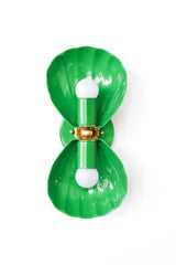 A double wall sconce in a true, saturated spring green, with two fluted shell shades meeting at an ornate brass floral rosette. This is a bolder, brighter green than a muted sage, so it reads more maximalist eclectic than English cottage, a strong choice for a botanical-leaning powder room, a Southern traditional space that wants a jolt of Ralph Lauren-style green, or a fully committed color bathroom that pairs it with pink or navy. Works as a standout statement against a neutral wall or layered into a room