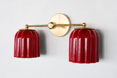 Gorgeous Cherry red ceramic wall sconce with two lights and brass hardware. Modern Handmade lighting with art deco details and real brass