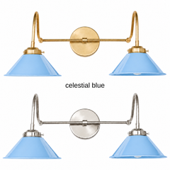 A sky blue two-light gooseneck wall sconce with glossy cone shades, shown in Celestial Blue with brass or nickel hardware. It has two curved gooseneck arms joined by a straight crossbar at a round backplate, so it sits wide like a vanity light. Hang it over a bathroom mirror, above a kitchen sink, or in a kids bathroom. Sky blue looks fresh with white walls, yellow or pink accents, and light wood, so it suits coastal, Scandinavian, and cheerful cottage decor.
