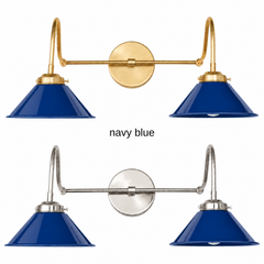 A navy blue two-light gooseneck wall sconce with glossy cone shades, shown in Navy with brass or nickel hardware. It has two curved gooseneck arms joined by a straight crossbar at a round backplate, so it sits wide like a vanity light. Hang it over a bathroom mirror, above a kitchen sink, or down a long hallway. Deep navy looks crisp with white shiplap, striped fabrics, and polished brass, so it suits nautical, coastal, and classic traditional decor.