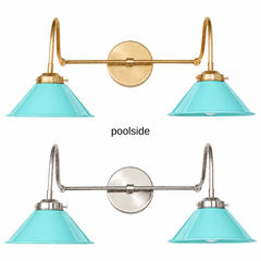 An aqua turquoise two-light gooseneck wall sconce with glossy cone shades, shown in Poolside with brass or nickel hardware. It has two curved gooseneck arms joined by a straight crossbar at a round backplate, so it sits wide like a vanity light. Hang it over a bathroom mirror, above a kitchen sink, or over a bar. Aqua pairs well with coral, pink, white shiplap, and rattan, so it suits coastal, beach house, and retro 50s bathroom and kitchen decor.
