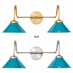 A teal blue two-light gooseneck wall sconce with glossy cone shades, shown in Teal with brass or nickel hardware. It has two curved gooseneck arms joined by a straight crossbar at a round backplate, so it sits wide like a vanity light. Hang it over a bathroom mirror, above a kitchen sink, or over a home bar. Teal looks great with orange or yellow accents, white walls, and walnut, so it suits mid century modern, colorful coastal, and eclectic rooms.