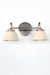 Double Kelly sconce in polished nickel with two cream metal cone shades, modern mid century wall light fixture for bathroom vanity lighting, bedroom bedside sconces, hallway lighting, and contemporary home decor, shown front view on a clean white background