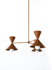 Chocolate brown is the color that makes a room feel rich, warm, and a little sultry, and this monochromatic Clancy chandelier commits all the way, shades, arms, and stem in one glossy fudge brown. Three double-cone bowtie shades radiate from a central sphere hub in a crisp Italian-inspired mid-century silhouette, throwing light up and down from each arm. It's built to anchor a dining table, kitchen island, or entry, the kind of statement piece that makes people ask whose house this is. Deep, earthy, and scu