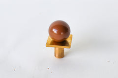 Modern square gumball drawer pull in glossy fudge brown with solid brass base—ideal for adding warmth and character to cabinetry, furniture, or bathroom vanities. A playful, retro-inspired hardware accent for kitchens, kids’ rooms, or vintage-style interiors with a touch of whimsy