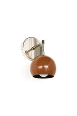 Front-view product photo of a Loa globe wall sconce featuring a rich fudge brown powder-coated steel shade paired with a reflective chrome backplate and stem. The compact dome silhouette adds a pop of color while staying minimal and architectural. Ideal as a modern bathroom sconce, kitchen accent light, or small-space wall lamp for apartments, studios, and layered lighting plans.