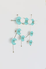 The Gemini One in Poolside and chrome is a playful celestial wall light inspired by the Gemini star constellation. Soft aqua-blue discs pair with polished chrome arms and white globe bulbs for a look that feels fresh, graphic, and a little bit retro. This colorful statement sconce works beautifully in kids’ rooms, nurseries, playrooms, bathrooms, eclectic interiors, and design-forward spaces that need a fun but polished focal point. Its constellation-inspired shape makes it especially appealing for zodiac l