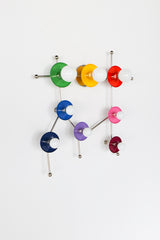 The Rainbow Gemini One in chrome is a colorful constellation wall sconce that brings a fresh, playful edge to the Gemini zodiac motif. Rainbow discs in bright saturated colors are paired with sleek chrome hardware, giving the piece a cooler, more modern feel than the brass version. This unique wall light is ideal for kids’ rooms, playrooms, eclectic interiors, colorful bathrooms, creative studios, and maximalist homes where statement lighting doubles as sculptural wall art.