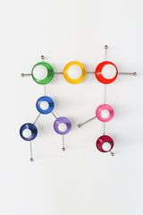 Designed after the Gemini star constellation, this Rainbow Gemini One sconce uses a lively mix of rainbow tones and polished chrome arms to create a bold celestial statement. The colorful palette feels cheerful and graphic, while the chrome finish gives it a crisp contemporary look that fits playful modern interiors, quirky designer spaces, and pop-art-inspired rooms. It is especially well suited for nurseries, children’s bedrooms, reading corners, creative family spaces, or any room that calls for fun, unf