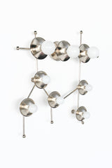 The Gemini One Sconce in Chrome is a polished, constellation-inspired wall light with globe bulbs arranged to echo the stars of the Gemini zodiac sign. Its chrome finish, slender branching arms, and sculptural star-map layout make it feel modern, playful, and architectural. Perfect for contemporary bedrooms, kids rooms, nurseries, hallways, astrology decor, celestial interiors, and statement wall lighting. Search terms: chrome sconce, zodiac wall light, constellation sconce, Gemini lighting, modern celestia