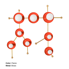 The Flame and Brass Gemini One sconce is a bold, constellation-inspired wall light designed to echo the shape of the Gemini zodiac sign. This sculptural fixture features vivid flame-orange metal discs paired with polished chrome arms and white globe bulbs, creating a graphic, celestial silhouette that feels both playful and modern. Shown here in a studio setting against a clean white background, this colorful statement sconce works beautifully in eclectic interiors, maximalist spaces, creative studios, kid