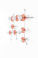 This peach and chrome Gemini One fixture transforms the Gemini constellation into graphic wall lighting with a soft pastel palette and clean metallic finish. The peach circular shades and polished chrome structure create a look that feels equal parts modern, quirky, and artistic. It is ideal for playful bathrooms, imaginative children’s spaces, colorful bedrooms, and interiors designed by people who love astrology, pop art, or distinctive statement lighting that feels personal and unexpected.