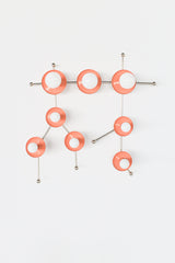 The peach and chrome Gemini One is a sculptural wall sconce designed in the shape of the Gemini constellation, making it both a functional light fixture and a decorative focal point. Its glossy peach discs, polished chrome details, and white globe bulbs give it a bright, cheerful personality that suits maximalist homes, eclectic interiors, art-filled spaces, and whimsical kids’ rooms. This unique zodiac-inspired sconce is especially well suited for customers looking for colorful statement lighting with a pl