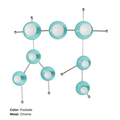 The poolside and Chrome Gemini One sconce is a bold, constellation-inspired wall light designed to echo the shape of the Gemini zodiac sign. This sculptural fixture features vivid flame-orange metal discs paired with polished chrome arms and white globe bulbs, creating a graphic, celestial silhouette that feels both playful and modern. Shown here in a studio setting against a clean white background, this colorful statement sconce works beautifully in eclectic interiors, maximalist spaces, creative studios.