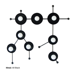 Studio-style description for the all black Gemini One sconce, a sculptural zodiac wall light shaped like the Gemini star constellation. Black circular star discs and black constellation arms create a graphic modern silhouette, while the white globe bulbs add contrast like bright stars against a night sky. This all black astrology light feels bold, celestial, and artful, perfect for modern maximalist decor, moody powder rooms, black and white interiors, eclectic bedrooms, hallway lighting, and anyone searchi