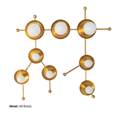 All-brass Gemini One wall sconce photographed on a clean white background, showing its constellation-inspired layout of brass rods, round star discs, and white globe bulbs. This sculptural brass fixture works for modern eclectic homes, celestial nurseries, playful powder rooms, entryways, bedrooms, and design-forward hallways. Strong search terms include Gemini sconce, zodiac wall light, brass globe sconce, astrology lighting, and modern statement sconce.