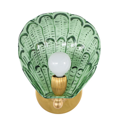 Front view of the Coquille wall sconce featuring a hand-painted shell-shaped shade in layered greens including vista green and olive, crafted from powder-coated steel with a sealed clear coat, paired with a glowing bulb and brass hardware, designed and handmade in New Orleans for eclectic, coastal-inspired interiors