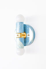 Hydrangea, Cream, and Gold hand-marbled Small Thalia Sconce with soft blue and cream swirls, brass hardware, and white globe bulbs. This compact two-light wall sconce is a colorful choice for bathroom vanity lighting, powder rooms, kids bathrooms, coastal interiors, cottage style spaces, and blue and white grandmillennial decor.