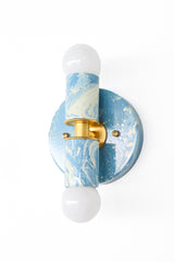 Hydrangea and Cream Marbled Small Thalia Sconce with gold hardware and two exposed globe bulbs, offering a soft mix of color, pattern, and shine. This petite decorative sconce is ideal for small bathrooms, kids bathrooms, guest baths, powder rooms, blue wallpaper, cottage interiors, coastal homes, and cheerful custom lighting schemes.