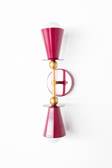 This Black Cherry vanity sconce is built for rooms that want depth and drama, whether that's flanking a bathroom mirror, anchoring a home bar, or adding warmth to a hallway. The double cone shape and brass ball hardware keep the silhouette clean and symmetrical, letting the deep wine color carry the room. A good option for a darker, more grown-up palette that still feels warm.
