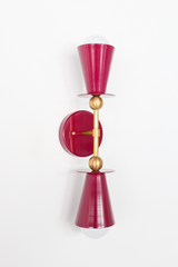 Installed as a pair, this Black Cherry vanity sconce brings a rich, wine-toned depth to a powder room, moody library, or home bar setup. The double cone shape and brass ball hardware keep it feeling considered rather than gothic, so it reads sophisticated instead of heavy-handed. A strong pick for anyone building a darker, more dramatic palette without losing warmth.
