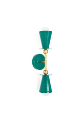 Angled view of the Janus double sconce in mermaid green with brass details, architectural wall lighting with a graphic silhouette, bold modern bathroom fixture for maximalists, artsy homes, and anyone who wants a quirky, personality packed vanity sconce.