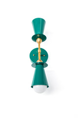 Geometric Janus double wall sconce in mermaid green with brass hardware, bold cone shades and globe bulbs stacked vertically, mid century modern wall light with funky personality for eclectic bathrooms, playful powder coated lighting for people who don’t do boring.