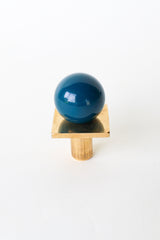 Lagoon blue and raw brass Square Gumball Knob featuring a glossy powder-coated orb on a square brass base. Modern drawer pull handcrafted in New Orleans, ideal for colorful kitchen cabinets, furniture makeovers, and custom home hardware with a bold, midcentury modern twist.
