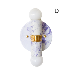 This handmade Thalia wall light combines a white and lavender marbled finish with brass accents for a look that is soft, artistic, and full of charm. It is especially well suited for bathroom vanity lighting, a stylish kids bathroom, a nursery, or a bedroom that leans pastel and playful. The gentle color palette makes it easy to style, while the marbling keeps it visually interesting. A great choice for feminine decor, eclectic interiors, dopamine decor, and chinoiserie-inspired spaces with a light, decorat