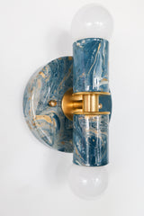 Angled view of a lagoon, cream, and gold marbled Thalia Sconce with brass accents and white globe bulbs on a white background. Sculptural two-light wall sconce or ceiling flush mount with glossy marbling and a bold modern profile, ideal for small spaces that need statement lighting.
Side profile / depth