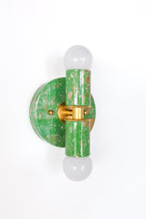 The hand-marbled Thalia sconce in spring green, cream, and gold blends playful color with a polished, design-forward look. Its petite scale makes it perfect for bathrooms, vanity lighting, and smaller rooms that need a little extra charm. No two sconces are alike, thanks to the hand-marbled finish, which gives each one a unique pattern and artful feel. Ideal for maximalist decor, eclectic interiors, colorful bathrooms, and anyone searching for a one-of-a-kind wall sconce with personality.