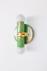 With its fresh spring green marbling, creamy accents, and warm gold detail, this Thalia sconce is a charming way to add personality to a bathroom or other compact space. Each fixture is individually hand-marbled, so every piece has its own distinct swirls, variation, and character. It is especially suited for colorful powder rooms, playful guest baths, eclectic homes, and dopamine decor spaces where a small but memorable pop of color goes a long way. A fun option for anyone who loves unique handmade lightin