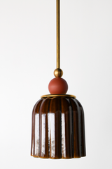 Chicory brown ceramic pendant light with ribbed shaped, celadon style glaze. Modern hand-made pendant light inspired by art deco design.  With a matte terra cotta ball and brass hardware.  Beautiful ceramic pendant light for bathrooms, small rooms, kitchens, and more. 