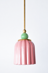 soft pastel Chinoiserie Pink ceramic ceiling pendant with brass hardware and a mint green powdercoated ball. Inspired by art deco glass with updated modern accents. This beautiful pendant light adds color and shape to any space. 