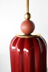 Rich, jewel tone red ceramic ceiling pendant with brass hardware and a matte terra cotta colored powdercoated ball. Inspired by art deco glass with updated modern accents. This beautiful pendant light adds color and shape to any space. 