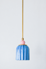 pastel light blue celadon-style glazed ribbed pendant light with blue pink powdercoated ball and brass hardware.  Art deco inspired pendant light fixture. Made in New Orleans by Sazerac Stitches