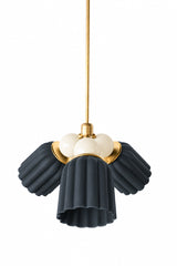 A small chandelier with matte, fluted ceramic cone shades in unglazed black, paired with glossy cream powder-coated steel balls and brass hardware. The high contrast between the cream balls and black shades gives this a versatile, neutral edge that still has real graphic presence. A good fit for a traditional dining room or entry that wants a statement fixture without committing to a bold color.