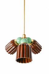 A small chandelier with glossy, glazed fluted ceramic cone shades in chicory brown, paired with soft vista green powder-coated steel balls and brass hardware. The sage-leaning green brings an earthy, botanical note against the rich brown glaze, a strong fit for an English cottage dining room or a traditional space layered with natural tones and brass.