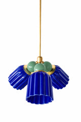 A small chandelier with deep, glossy cobalt fluted ceramic cone shades, paired with soft vista green powder-coated steel balls and brass hardware. The sage-leaning green brings an unexpected, botanical contrast against the saturated blue, a bold pick for a dining room or entry that wants real color without a predictable pairing.