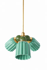 A small chandelier with glossy, glazed fluted ceramic cone shades in jade green, paired with deeper olive green connector balls and brass hardware. Two distinct greens, one bright and one earthy, give this real botanical depth rather than a single flat tone, a strong fit for a conservatory, an English cottage dining room, or any traditional space leaning into natural color.